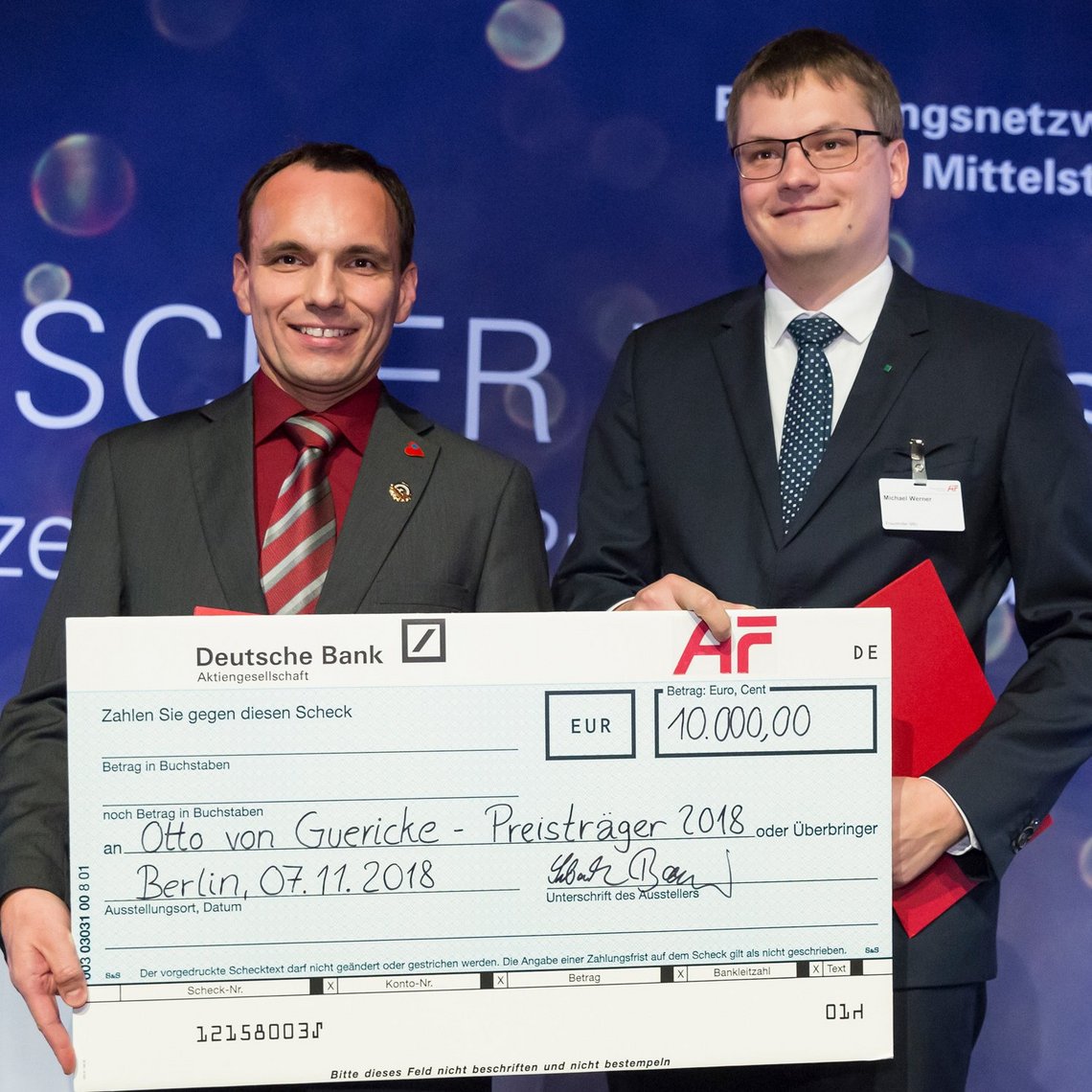 Das Bild zeigt die Otto von Guericke-Preisträger 2018: Dr. Grzegorz Śliwiński und Michael Werner